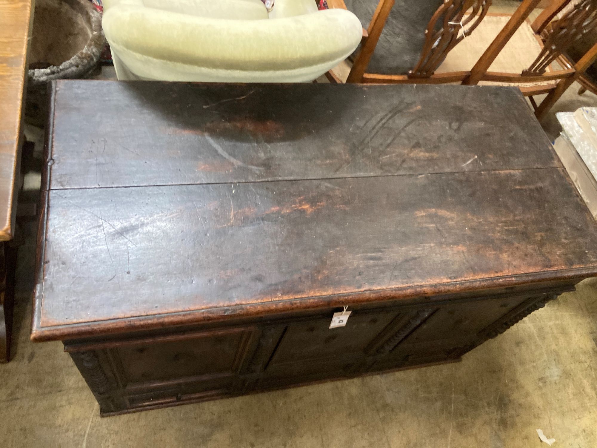 An 18th century panelled oak mule chest, length 117cm, depth 56cm, height 70cm